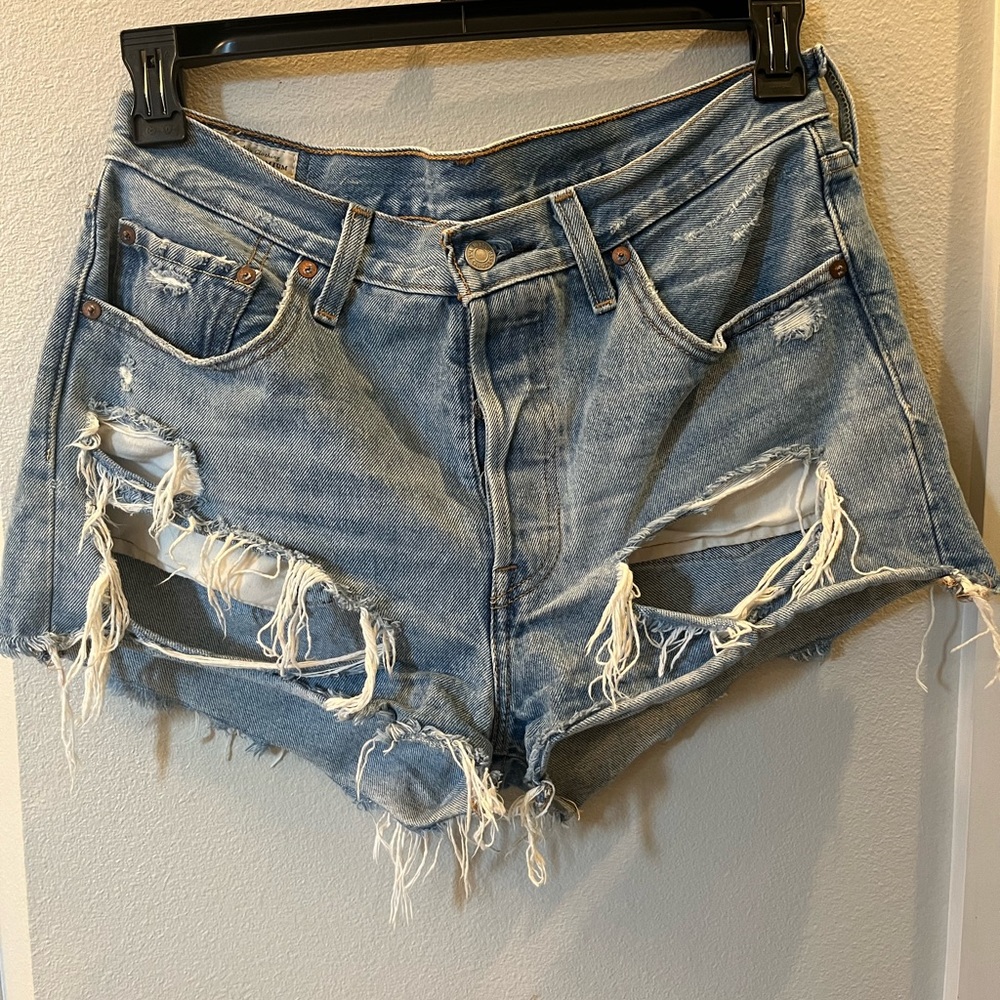 Levi's (men's) jeans repurposed to women's cutoff shorts. Perfect for festivals!